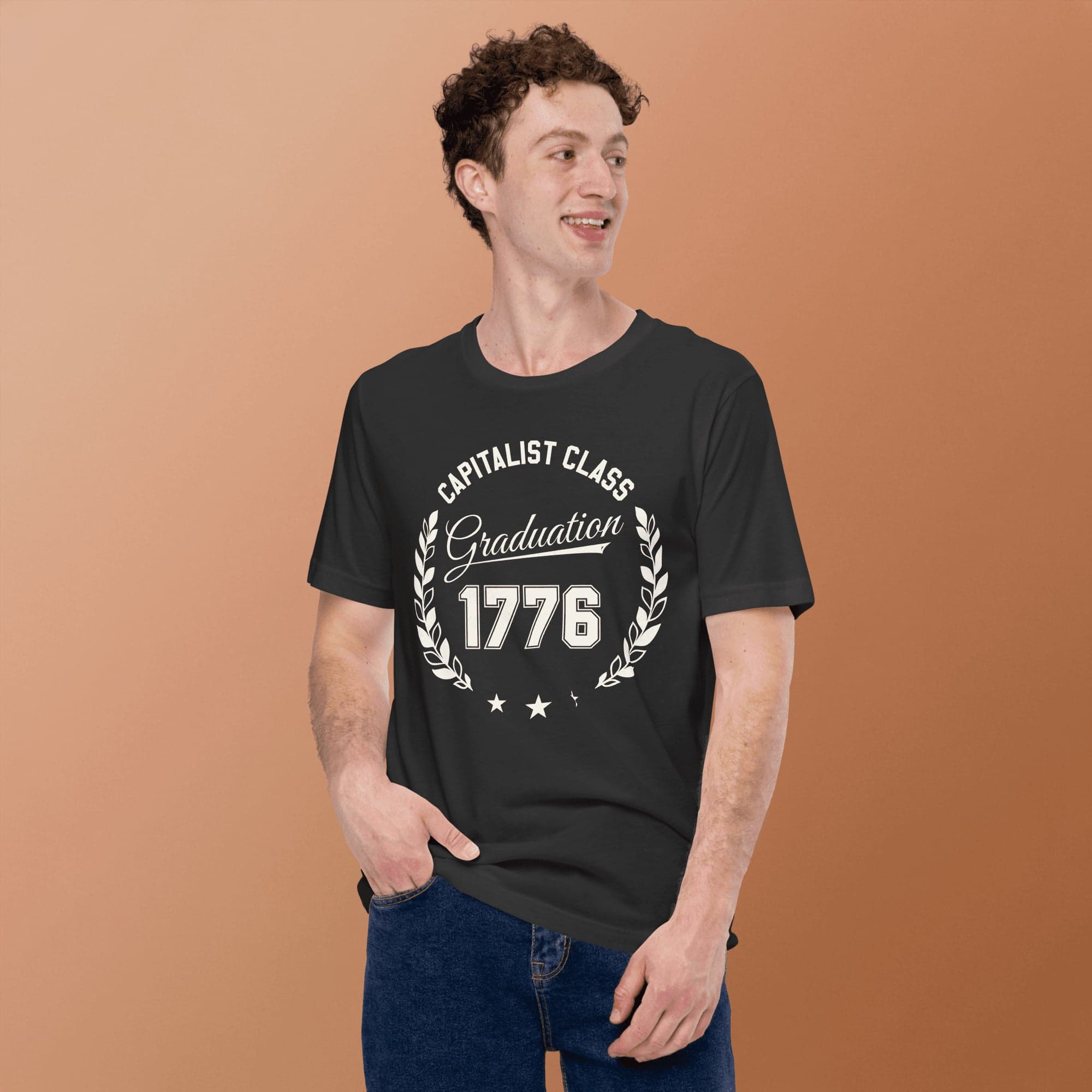 A man wearing a dark grey Veritas Ethos graphic t-shirt.